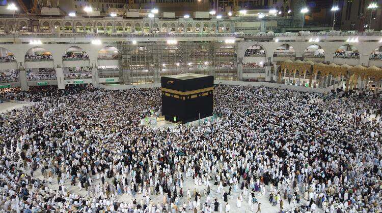 People performing Umrah and Hajj by walking around the Kaaba in Mecca 
